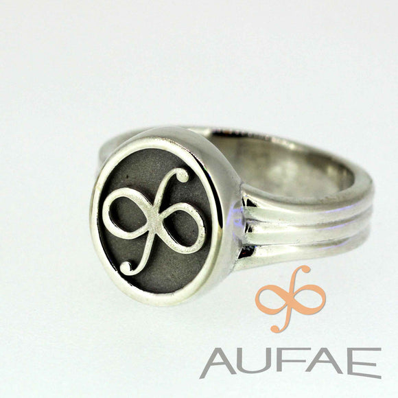 Aufae Infintegral Logo ring in sterling silver with a permanently bound solid 14K infintegral symbol atop textured sterling silver